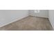 Bedroom with carpeted floors, neutral walls, a window, and electrical outlets at 454 Sunfish Dr, Winter Haven, FL 33881