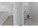 The laundry room features tiled floors, and hook ups for a washer and dryer at 454 Sunfish Dr, Winter Haven, FL 33881
