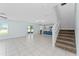 Open-concept living room with tile floors, sliding glass doors, and easy access to the kitchen at 454 Sunfish Dr, Winter Haven, FL 33881