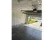 An empty single car garage with an automatic door and concrete floor ready for parking or storage at 506 Myakka Pl, Kissimmee, FL 34759