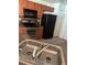 Functional kitchen features stainless steel oven, dark counters, and double sink at 506 Myakka Pl, Kissimmee, FL 34759