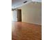 Spacious living room with neutral walls, laminate flooring, and ample natural light at 506 Myakka Pl, Kissimmee, FL 34759
