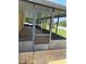 Enclosed screened porch and backyard at 506 Myakka Pl, Kissimmee, FL 34759