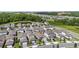 Community aerial view showcasing proximity to highway, lush greenery, and well-spaced homes at 7848 Somersworth Dr, Kissimmee, FL 34747