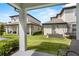 View of the backyard with seating and a trampoline at 7848 Somersworth Dr, Kissimmee, FL 34747