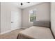 Cozy bedroom with neutral carpet, a soft bed, a window with blinds, and a ceiling fan at 7848 Somersworth Dr, Kissimmee, FL 34747