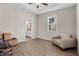 Bright bedroom with hardwood floors, ensuite bathroom, and a ceiling fan at 7848 Somersworth Dr, Kissimmee, FL 34747