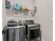 Laundry room featuring stainless steel washer and dryer at 7848 Somersworth Dr, Kissimmee, FL 34747