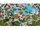 Aerial view of lazy river with lush landscaping and various aquatic activities at 7848 Somersworth Dr, Kissimmee, FL 34747