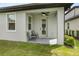 Covered patio with ceiling fan and seating area at 7848 Somersworth Dr, Kissimmee, FL 34747