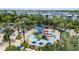 Gathering-friendly water park with slides, pools, lounge chairs, and tropical landscaping at 7848 Somersworth Dr, Kissimmee, FL 34747