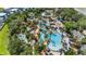 Aerial view showcases a resort water park with pools, slides, and cabanas at 7848 Somersworth Dr, Kissimmee, FL 34747