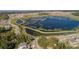 Scenic aerial view of the community's expansive lake and interconnected walking paths, perfect for outdoor enjoyment at 1456 Sourwood Dr, Ocoee, FL 34761