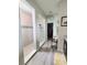 Bright bathroom featuring a walk-in shower with decorative tile accents and modern fixtures at 1456 Sourwood Dr, Ocoee, FL 34761