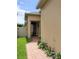Charming entryway featuring a black door, decorative plants, and a brick walkway at 1456 Sourwood Dr, Ocoee, FL 34761