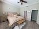 Inviting main bedroom features neutral tones, a king-size bed, and ample natural light, creating a peaceful ambiance at 1456 Sourwood Dr, Ocoee, FL 34761