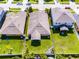 An aerial view shows the property within its neighborhood, highlighting the spacious lot and nearby homes at 1940 Banner Ln, St Cloud, FL 34769