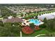 Aerial view featuring community pool, clubhouse, playground, and landscaping in a Gathering-friendly neighborhood at 1940 Banner Ln, St Cloud, FL 34769