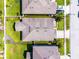 Aerial view showcases the property's roof, yard, and perimeter within a residential neighborhood at 1940 Banner Ln, St Cloud, FL 34769