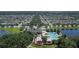 Beautiful aerial view of the community pool, playground, and surrounding homes in a well-maintained neighborhood at 1940 Banner Ln, St Cloud, FL 34769