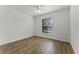 Bright bedroom with a large window and wood flooring at 1940 Banner Ln, St Cloud, FL 34769