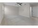 This bedroom features a ceiling fan, neutral walls, and carpet at 1940 Banner Ln, St Cloud, FL 34769