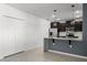 Modern kitchen features stainless steel appliances, granite countertops, and stylish pendant lighting at 1940 Banner Ln, St Cloud, FL 34769