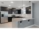 Beautiful kitchen featuring stainless steel appliances, granite countertops, and updated cabinets at 1940 Banner Ln, St Cloud, FL 34769