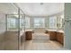Spacious bathroom with a soaking tub, large walk-in shower, and double vanities at 324 Sorrento Rd, Poinciana, FL 34759