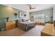 Bright bedroom with a large window overlooking a green landscape and neutral wall color at 324 Sorrento Rd, Poinciana, FL 34759