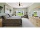 Bright bedroom with a large window overlooking a green landscape and neutral wall color at 324 Sorrento Rd, Poinciana, FL 34759