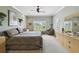 Spacious bedroom featuring neutral walls, a large window and a relaxing seating area at 324 Sorrento Rd, Poinciana, FL 34759