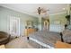 Bright bedroom featuring neutral walls, a large window, and access to a private outdoor area at 324 Sorrento Rd, Poinciana, FL 34759