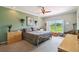 Bright bedroom with a large window overlooking a green landscape and neutral wall color at 324 Sorrento Rd, Poinciana, FL 34759