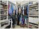 Spacious walk-in closet with built-in shelving for shoes and hanging clothes at 324 Sorrento Rd, Poinciana, FL 34759
