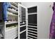 Custom closet with shelving and drawers, including a jewelry organizer built into the door at 324 Sorrento Rd, Poinciana, FL 34759