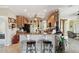 Kitchen with breakfast bar, tile floors, and seamlessly flows into other living spaces at 324 Sorrento Rd, Poinciana, FL 34759