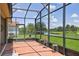 Inviting screened lanai offering picturesque views of the pond and well-maintained backyard at 324 Sorrento Rd, Poinciana, FL 34759