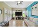 Bright living room with views and large windows with shutters overlooking well maintained yard at 324 Sorrento Rd, Poinciana, FL 34759