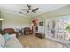 Open-concept living room with tile flooring, comfortable seating, and an open view to the kitchen at 324 Sorrento Rd, Poinciana, FL 34759