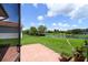 The open-air patio features geometric tile, and has serene views of the pond at 324 Sorrento Rd, Poinciana, FL 34759