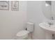 Powder room with pedestal sink and decor at 8937 Amelia Downs Trl, Kissimmee, FL 34747