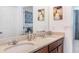 Bathroom with double sinks in front of the mirror at 8937 Amelia Downs Trl, Kissimmee, FL 34747