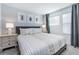 Calming bedroom with a comfortable bed, stylish decor, and soft lighting creating a relaxing atmosphere at 8937 Amelia Downs Trl, Kissimmee, FL 34747