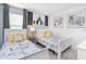 Charming bedroom features twin beds with whimsical decor at 8937 Amelia Downs Trl, Kissimmee, FL 34747