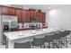 Modern kitchen featuring stainless steel appliances, a breakfast bar with seating, and ample counter space at 8937 Amelia Downs Trl, Kissimmee, FL 34747