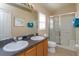 Double vanity bathroom with a large shower and tub at 2005 Royal Ridge Dr, Davenport, FL 33896