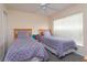 Guest bedroom with twin beds, ceiling fan and window coverings at 2005 Royal Ridge Dr, Davenport, FL 33896
