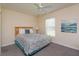 Bright bedroom featuring a queen-size bed and art at 2005 Royal Ridge Dr, Davenport, FL 33896