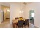 Dining area with four chairs and view of entryway at 2005 Royal Ridge Dr, Davenport, FL 33896